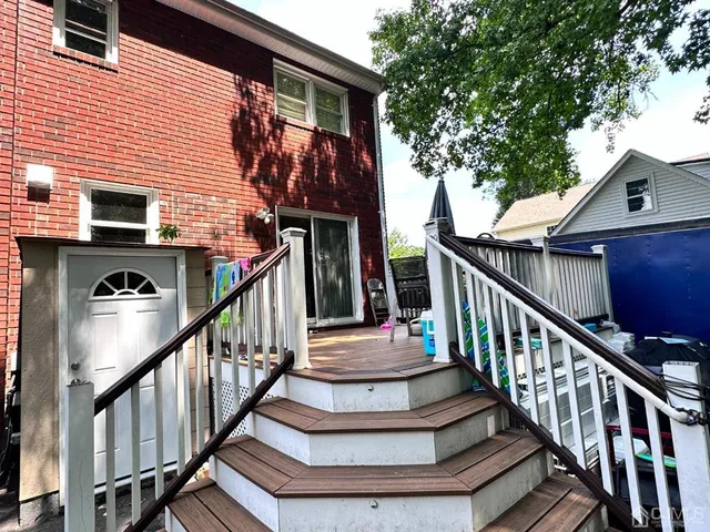 a view of entryway with wooden stairs