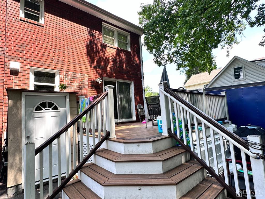 1722 Holly Road North Brunswick, NJ 08902 - Photo 20 of 22 a view of entryway with wooden stairs