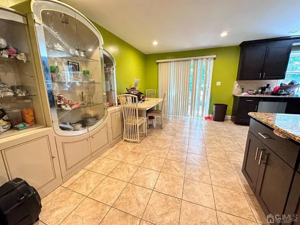 a kitchen with stainless steel appliances kitchen island granite countertop a sink and cabinets
