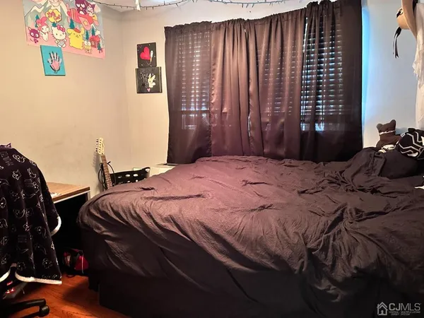 a bedroom with a bed and a cabinets