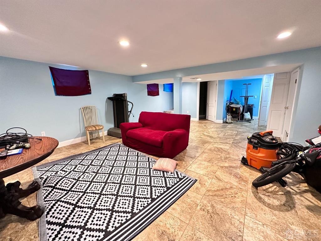 1722 Holly Road North Brunswick, NJ 08902 - Photo 10 of 22 a bedroom with furniture and a wooden floor