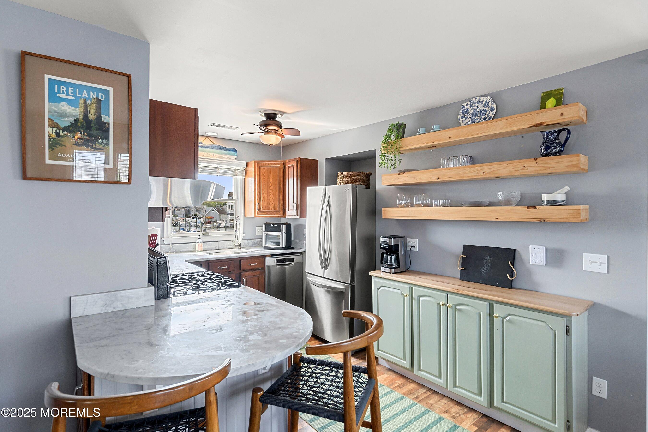 167 4th Avenue Manasquan, NJ 08736 - Photo 14 of 54 a kitchen with a table and chairs
