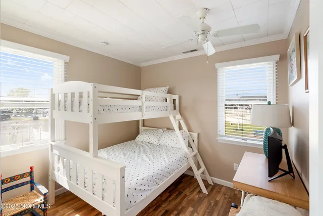 a bedroom with a bed and a desk