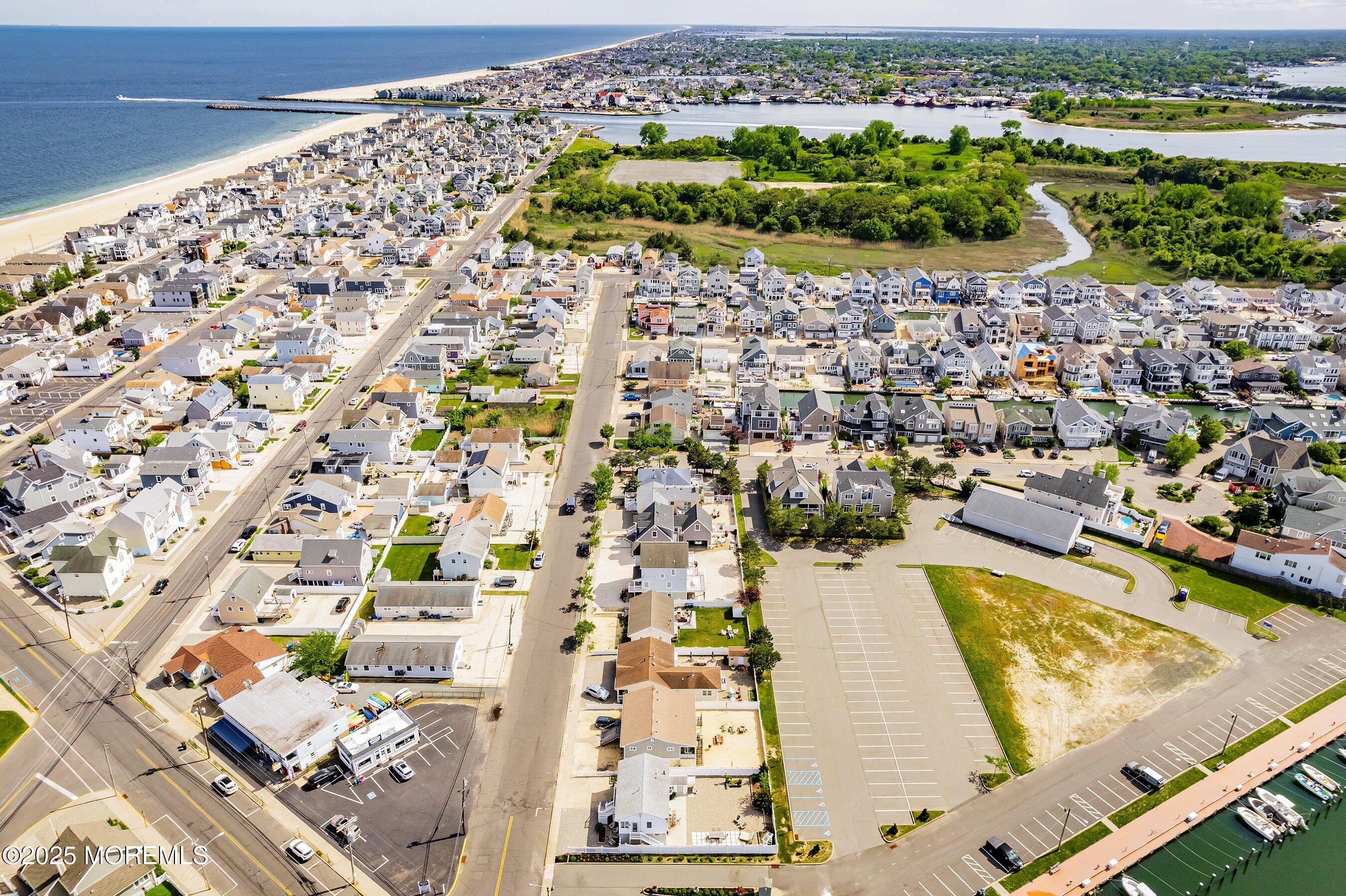 167 4th Avenue Manasquan, NJ 08736 - Photo 30 of 54 an aerial view of residential houses with outdoor space