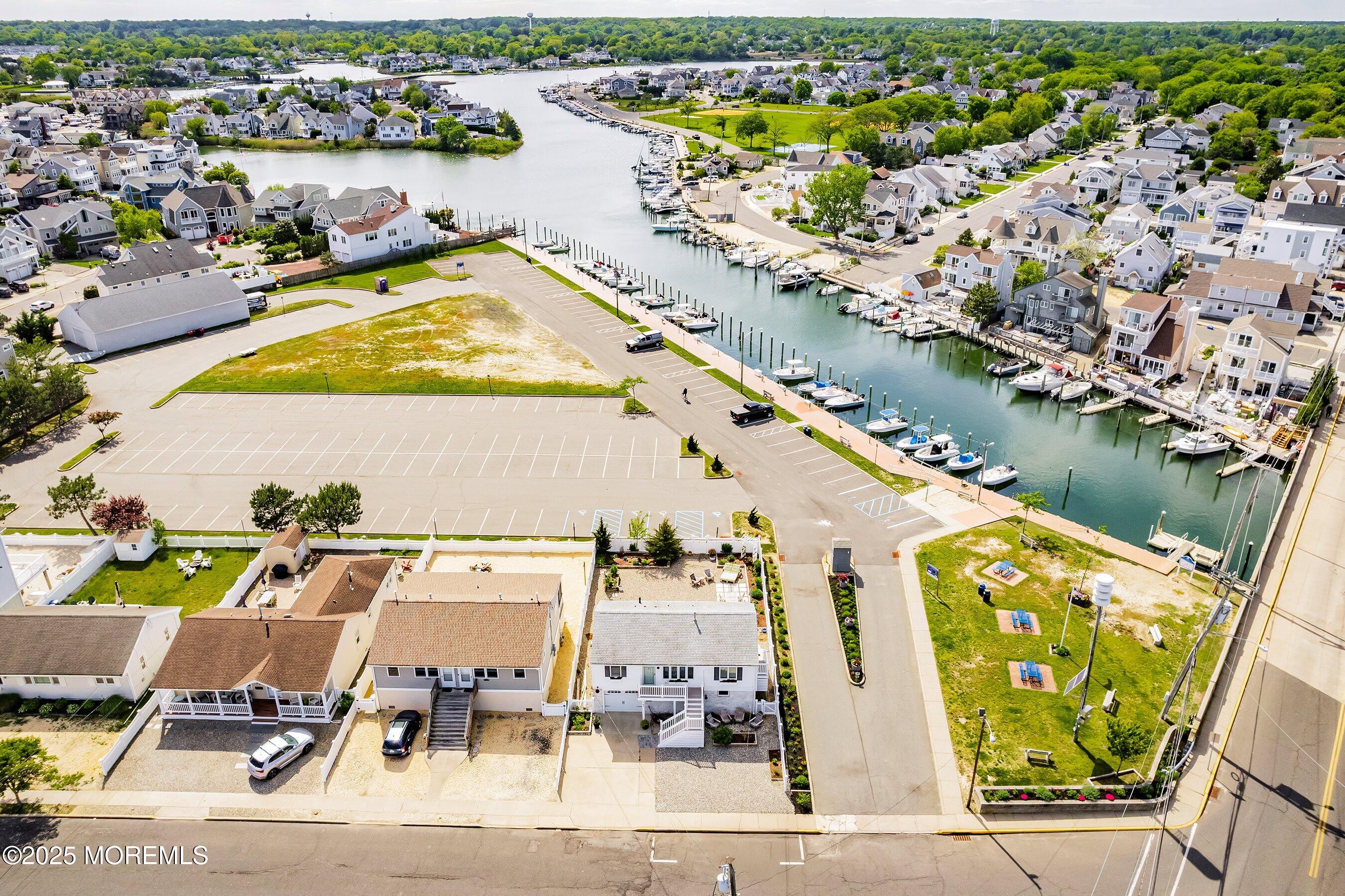 167 4th Avenue Manasquan, NJ 08736 - Photo 3 of 54 an aerial view of residential houses with outdoor space