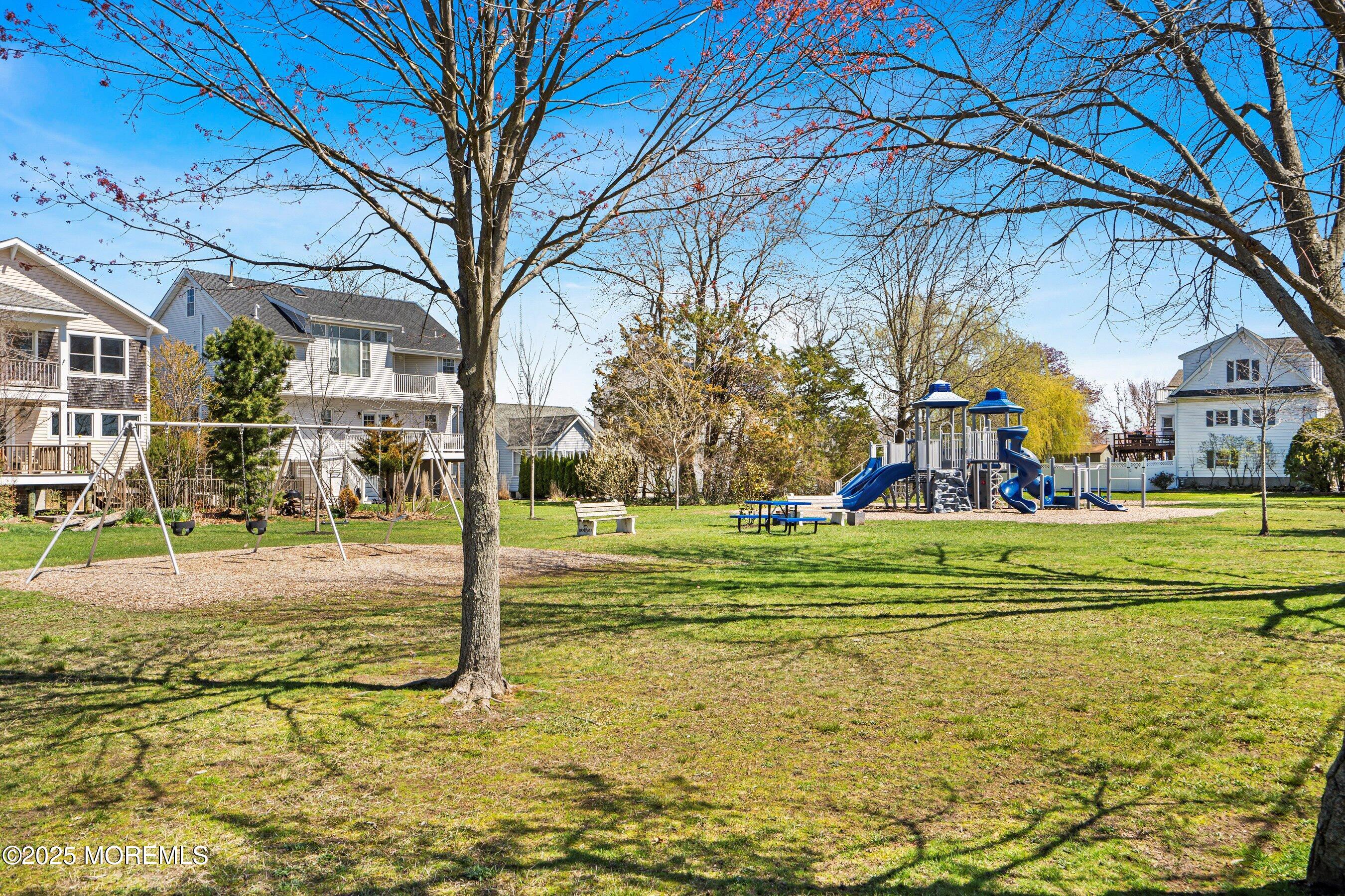 167 4th Avenue Manasquan, NJ 08736 - Photo 41 of 54 a view of a fountain in front of a house