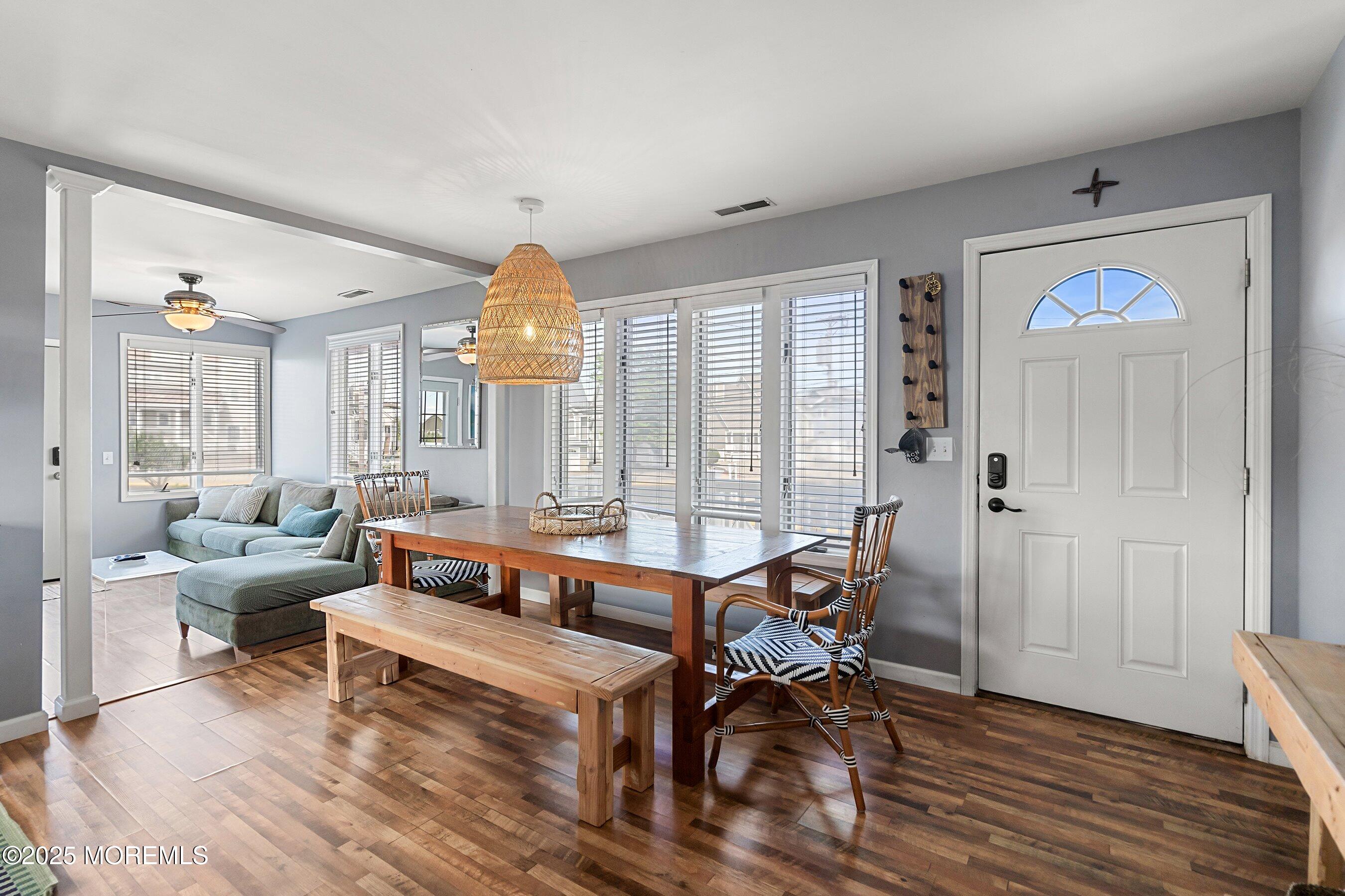 167 4th Avenue Manasquan, NJ 08736 - Photo 5 of 54 a living room with furniture and a chandelier