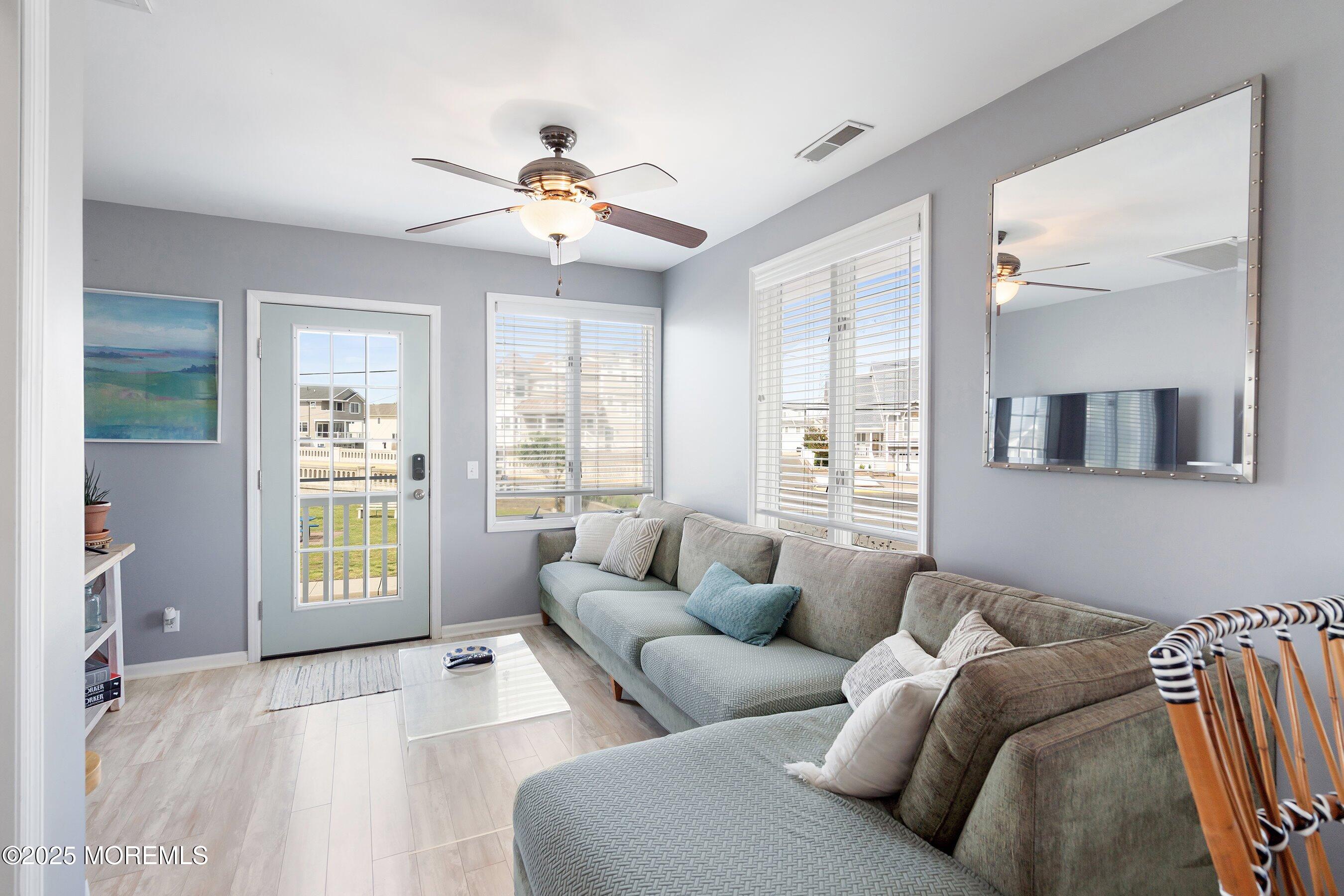 167 4th Avenue Manasquan, NJ 08736 - Photo 7 of 54 a living room with furniture and a large window
