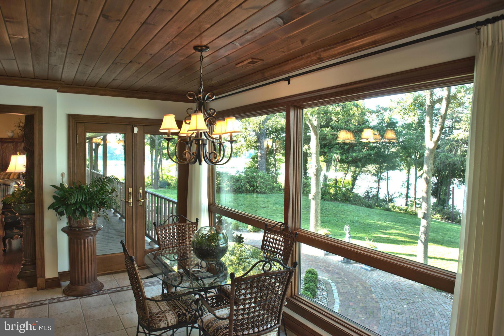 1822 Hatfield Road Huntingtown, MD 20639 - Photo 23 of 27 a view of a porch with furniture and garden