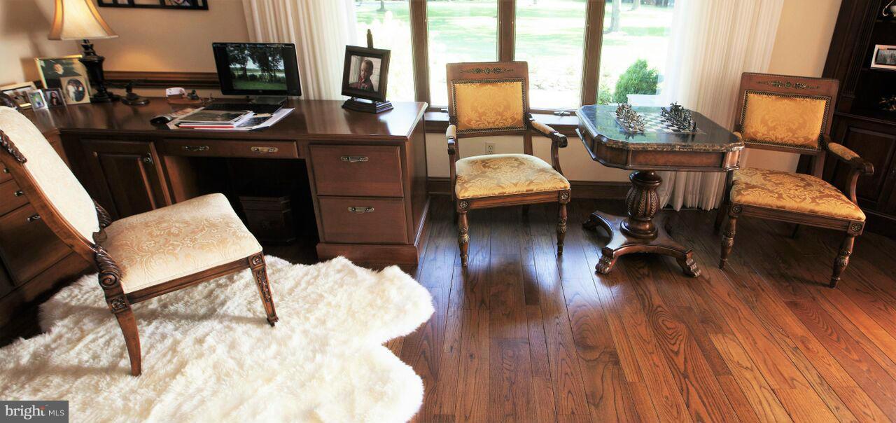 1822 Hatfield Road Huntingtown, MD 20639 - Photo 27 of 27 a view of a workspace with furniture and a flat screen tv