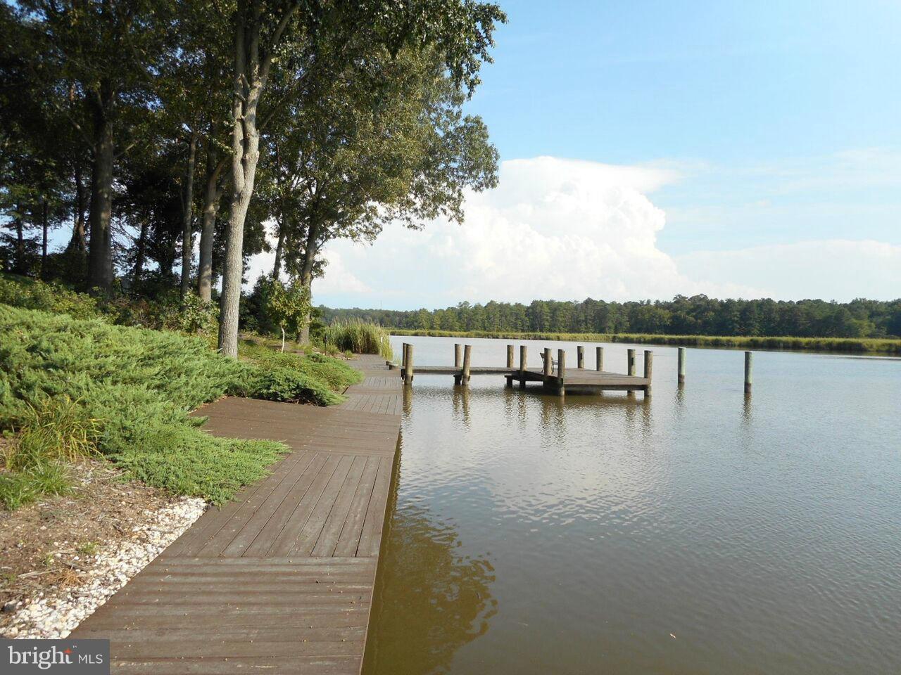 1822 Hatfield Road Huntingtown, MD 20639 - Photo 8 of 27 a view of a lake with houses in the back