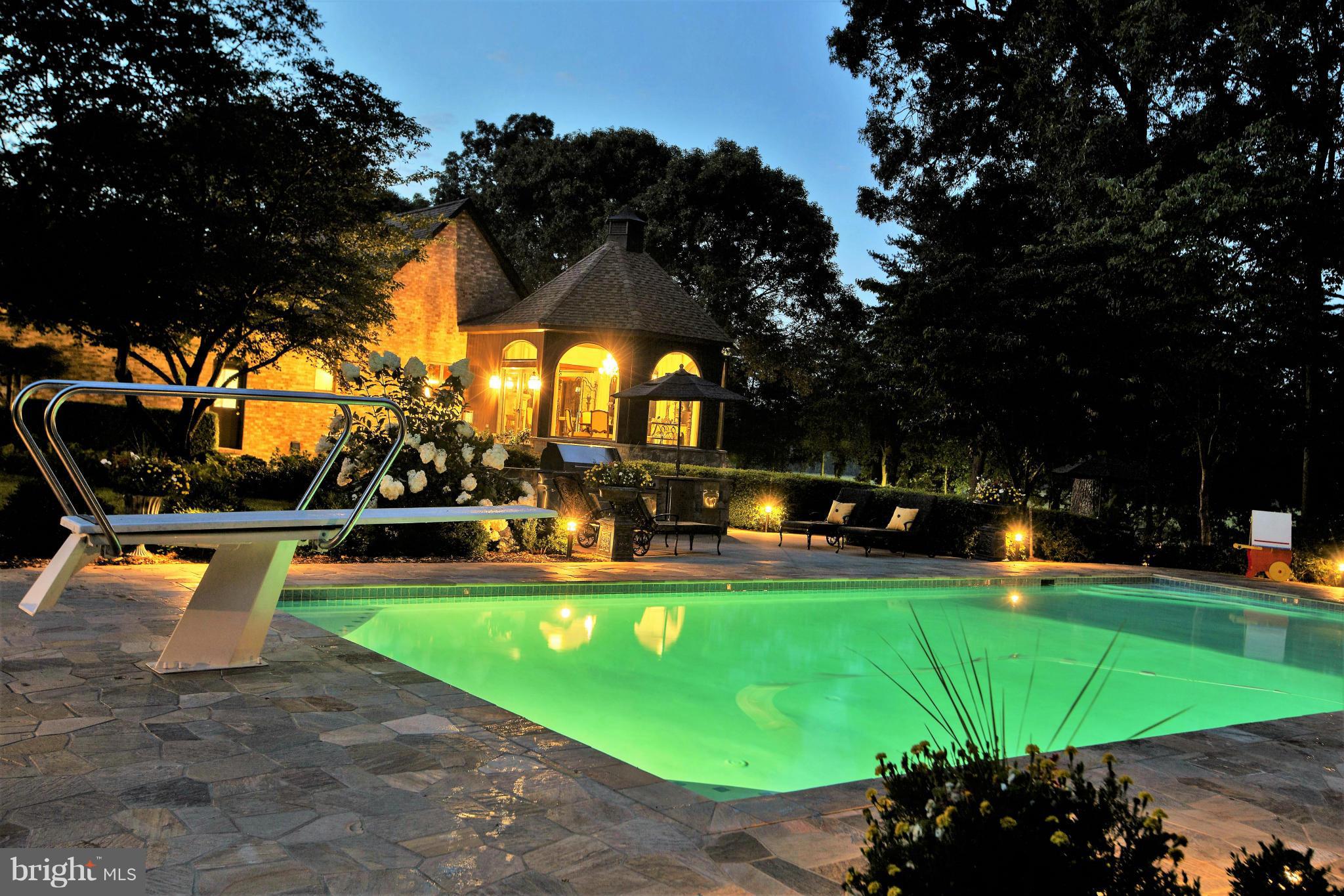 1822 Hatfield Road Huntingtown, MD 20639 - Photo 9 of 27 a view of a swimming pool with a patio and plants