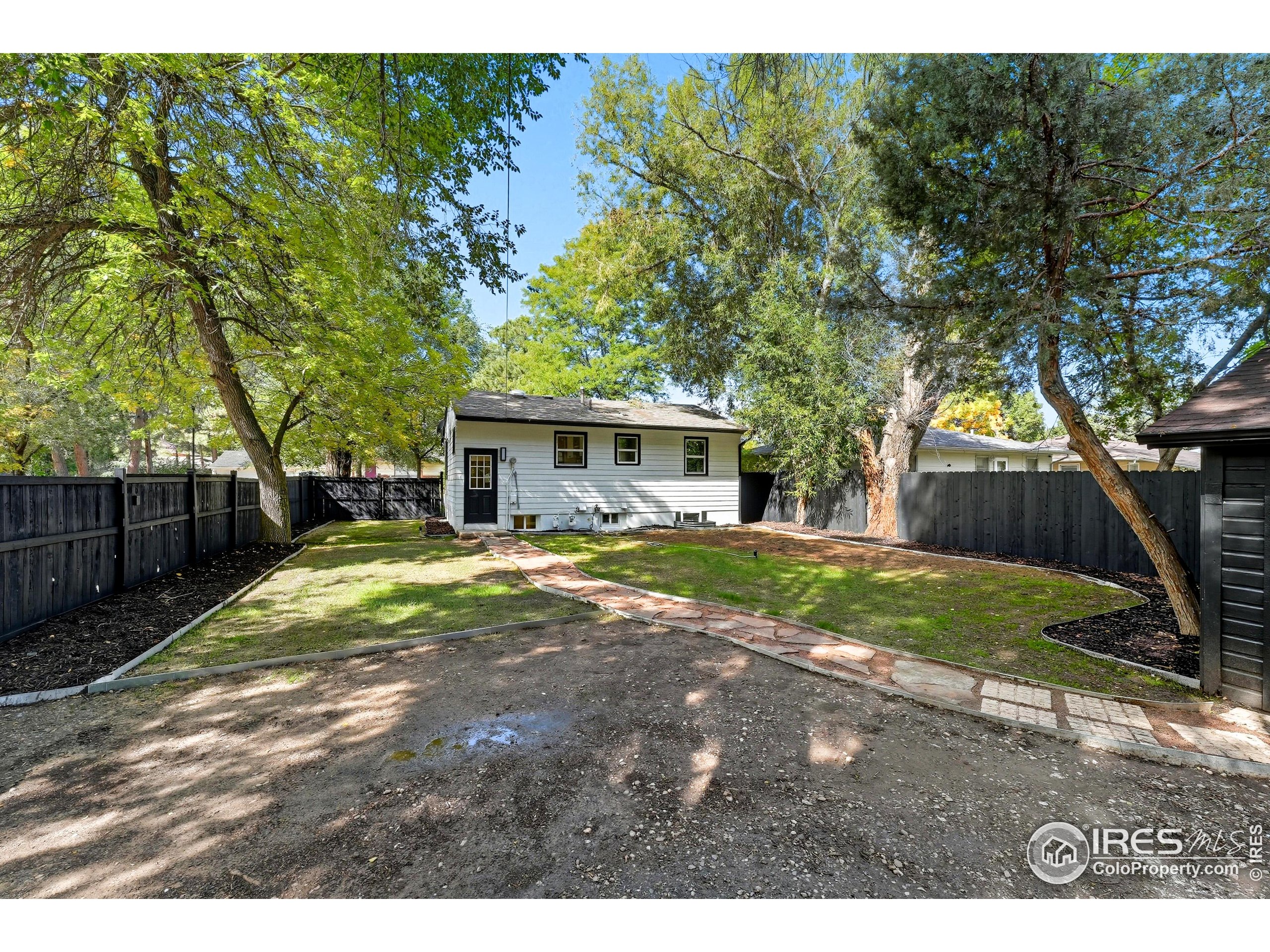 200 Bishop Street Fort Collins, CO 80521 - Photo 29 of 33 a view of house with backyard and a tree