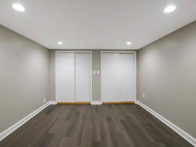 a view of room with wooden floor