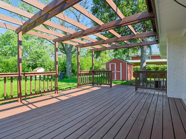 a view of porch with deck and wooden floor