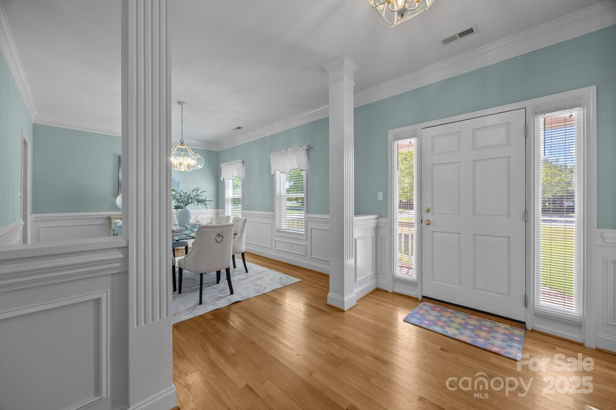 908 Haddonfield Drive Fort Mill, SC 29708 - Photo 14 of 48 a view of a livingroom with furniture wooden floor and a chandelier