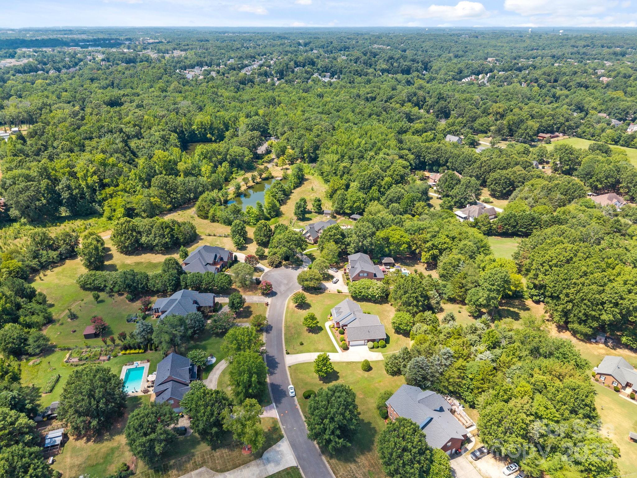 908 Haddonfield Drive Fort Mill, SC 29708 - Photo 8 of 48 an aerial view of a residential houses with outdoor space and trees