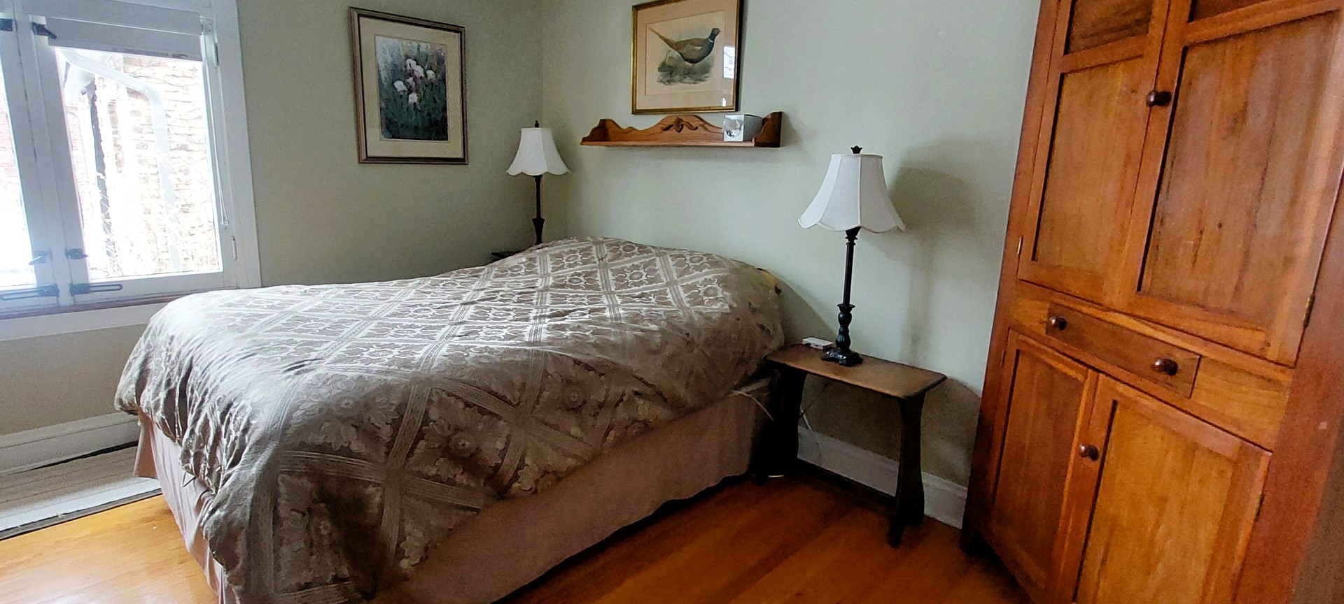 10101 South Hoyne Avenue Chicago, IL 60643 - Photo 12 of 22 a bed sitting in a bedroom next to a window