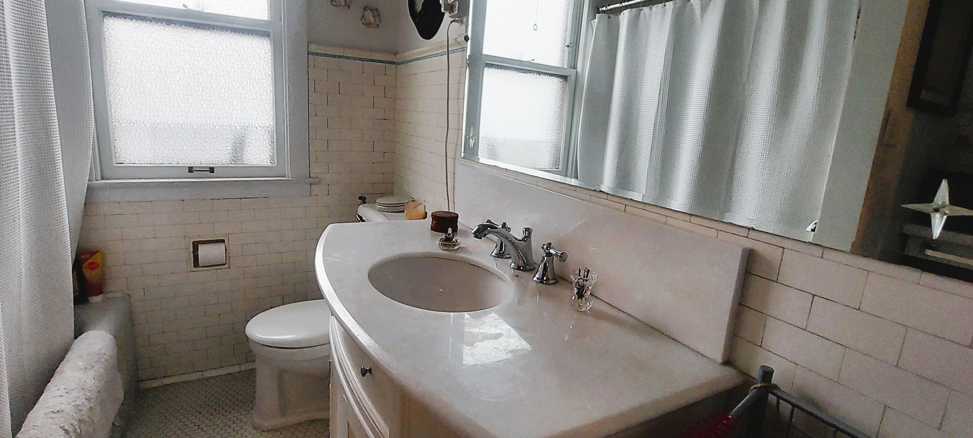 10101 South Hoyne Avenue Chicago, IL 60643 - Photo 17 of 22 a bathroom with a sink a toilet and a mirror