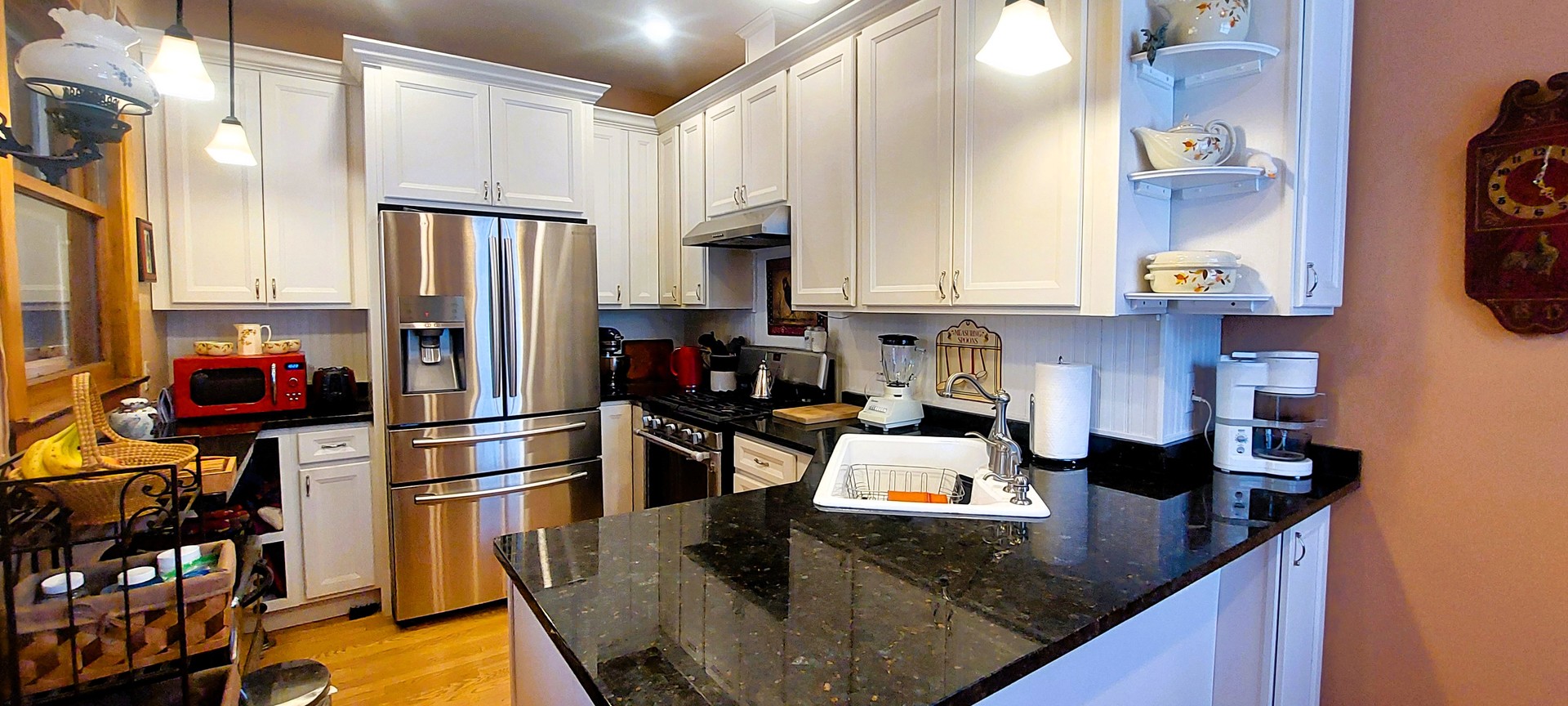 10101 South Hoyne Avenue Chicago, IL 60643 - Photo 10 of 22 a kitchen with stainless steel appliances granite countertop a refrigerator a stove and white cabinets with wooden floor