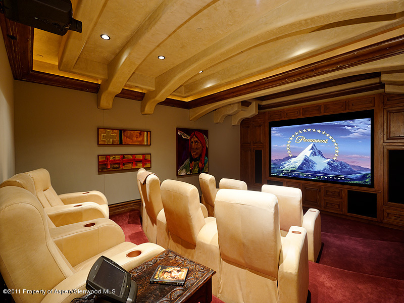 142 Wrights Road Aspen, CO 81612 - Photo 11 of 33 a living room with furniture a rug and a projector