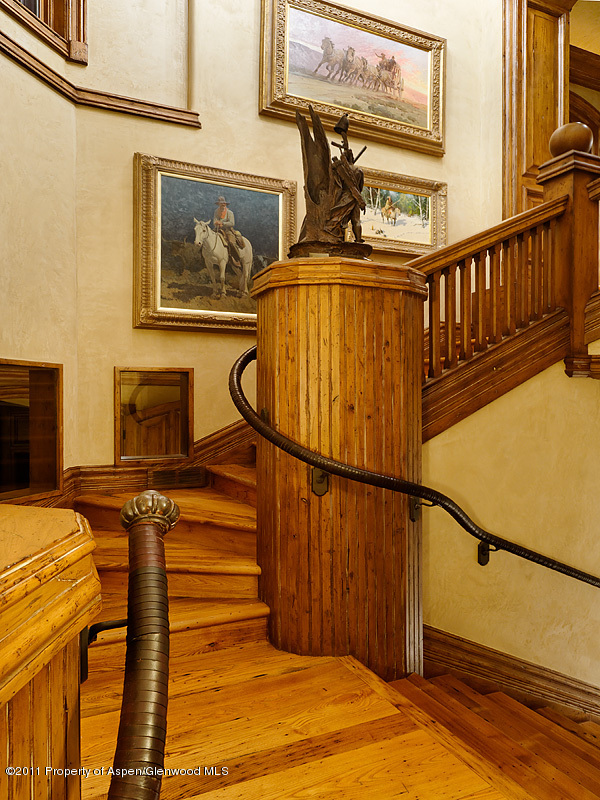142 Wrights Road Aspen, CO 81612 - Photo 17 of 33 a view of staircase with a lots of frames on the wall