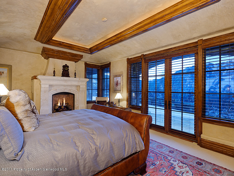 142 Wrights Road Aspen, CO 81612 - Photo 20 of 33 a bed sitting in a spacious bedroom next to a window