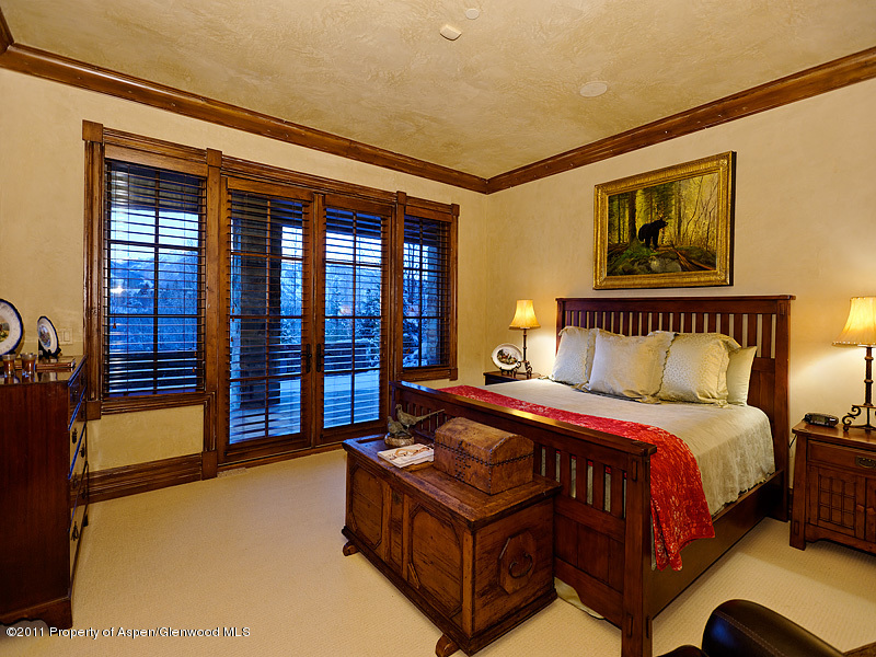 142 Wrights Road Aspen, CO 81612 - Photo 21 of 33 a bed sitting in a spacious bedroom next to a window