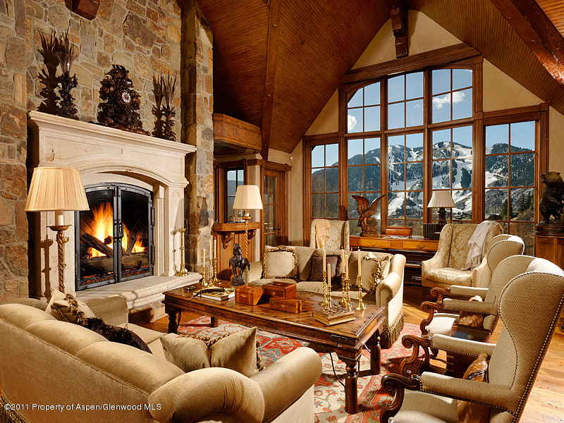 142 Wrights Road Aspen, CO 81612 - Photo 4 of 33 a living room with furniture a fireplace and floor to ceiling windows