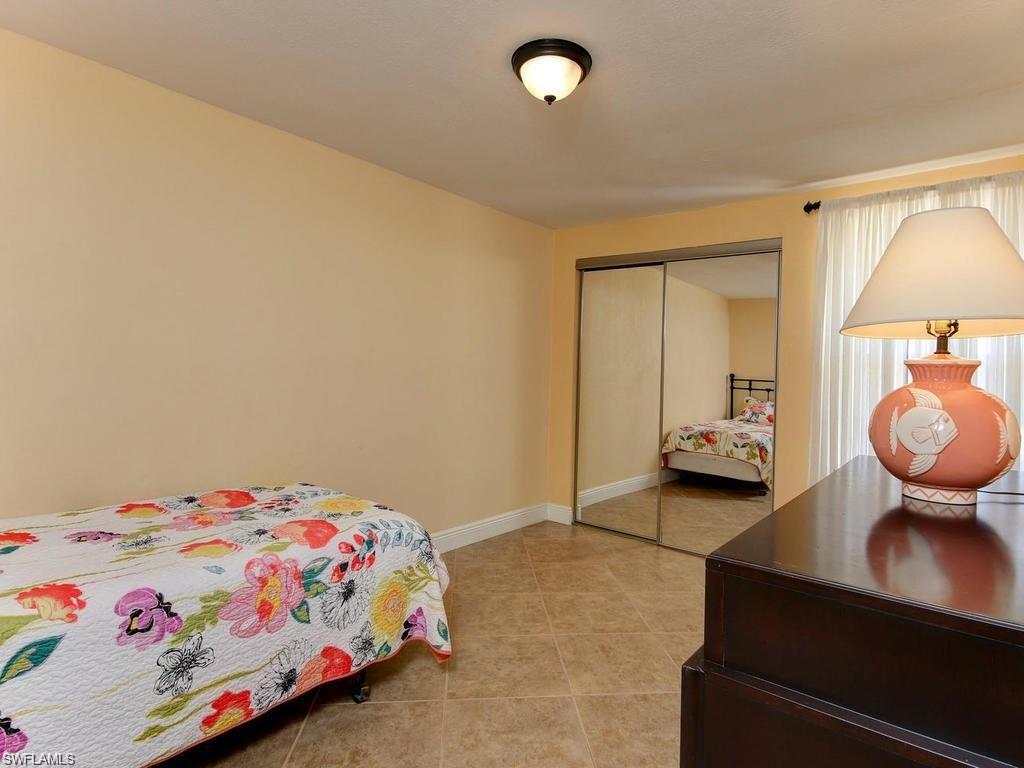 4912 Hawaii Boulevard Naples, FL 34112 - Photo 9 of 12 a bedroom with a bed and teddy bear