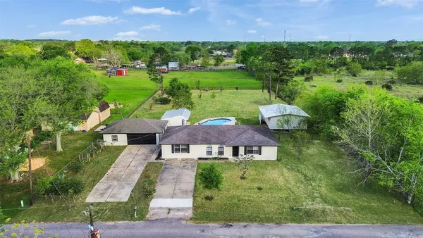 an aerial view of a house with garden