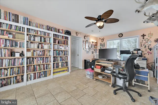 a living room with furniture cabinets and book shelf