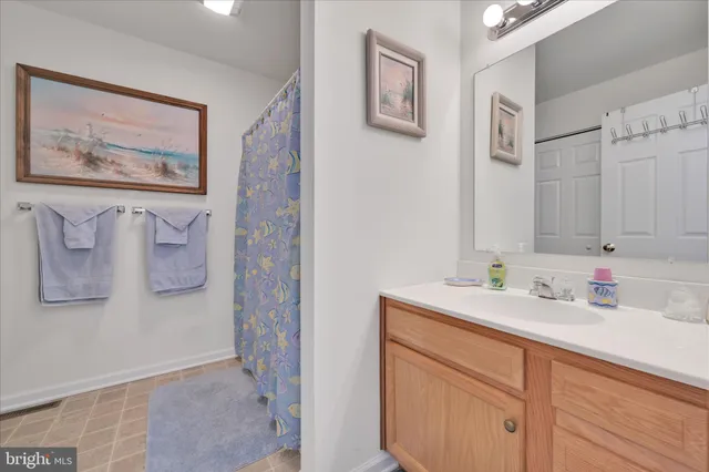 a bedroom with bunk bed and a window