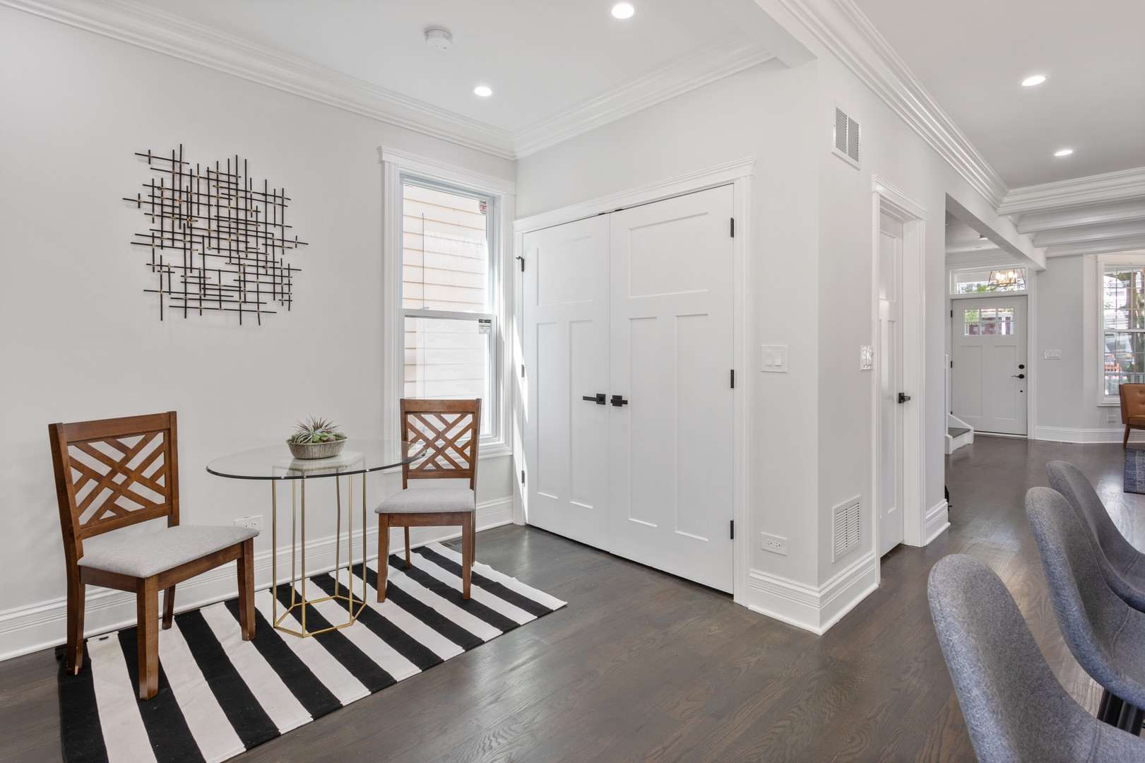 2743 North Ridgeway Avenue Chicago, IL 60647 - Photo 12 of 33 a view of a hallway with two couches and a dining room view