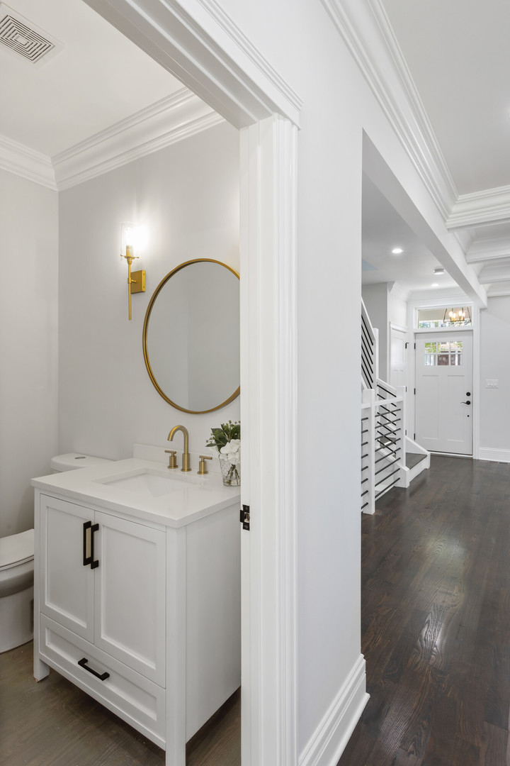 2743 North Ridgeway Avenue Chicago, IL 60647 - Photo 13 of 33 a bathroom with a sink and a mirror