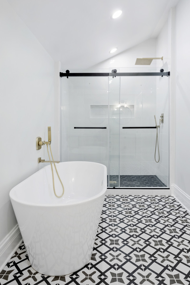 2743 North Ridgeway Avenue Chicago, IL 60647 - Photo 18 of 33 a white bath tub sitting in a bathroom