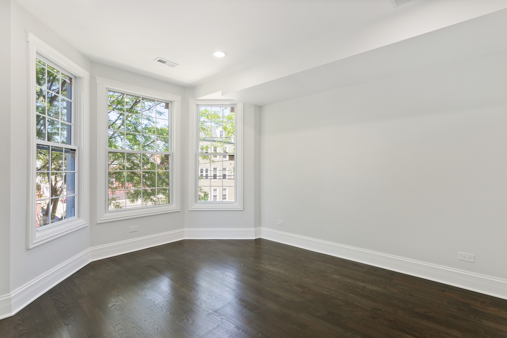 2743 North Ridgeway Avenue Chicago, IL 60647 - Photo 25 of 33 a view of an empty room with wooden floor and a window