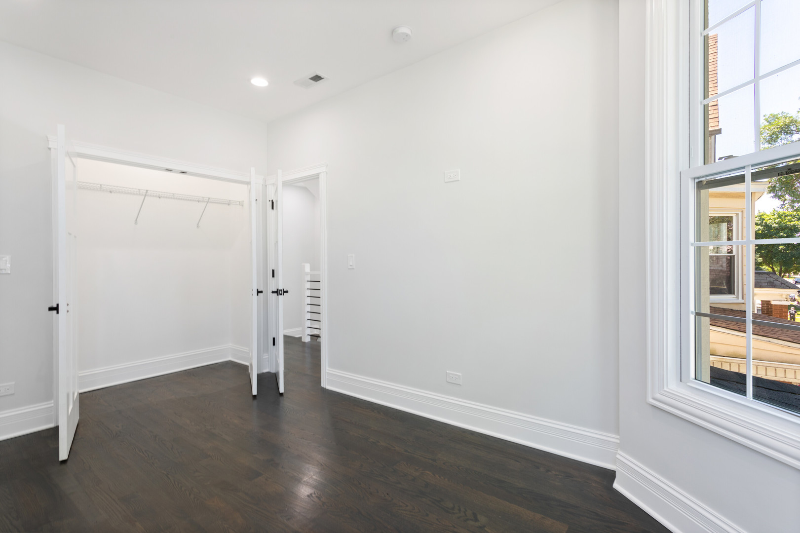 2743 North Ridgeway Avenue Chicago, IL 60647 - Photo 26 of 33 an empty room with wooden floor and windows