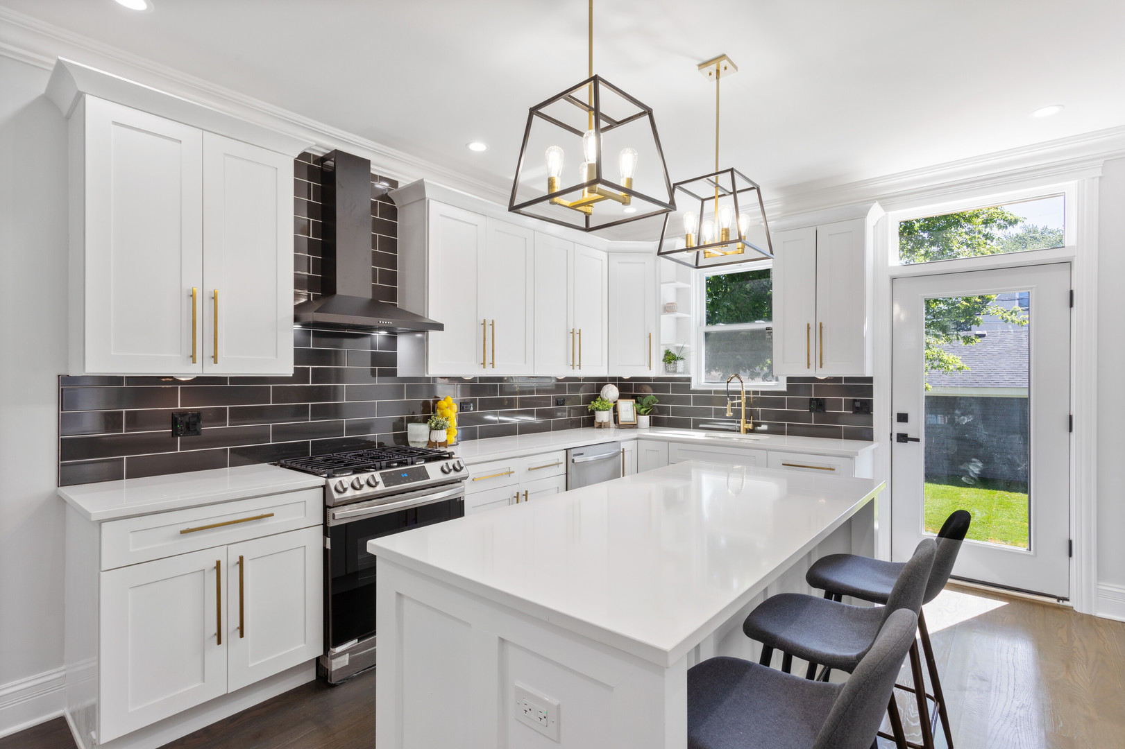 2743 North Ridgeway Avenue Chicago, IL 60647 - Photo 5 of 33 a kitchen with a table chairs stove and cabinets