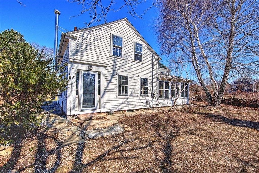 408 Hixbridge Road Westport, MA 02790 - Photo 2 of 35 a front view of a house with a yard