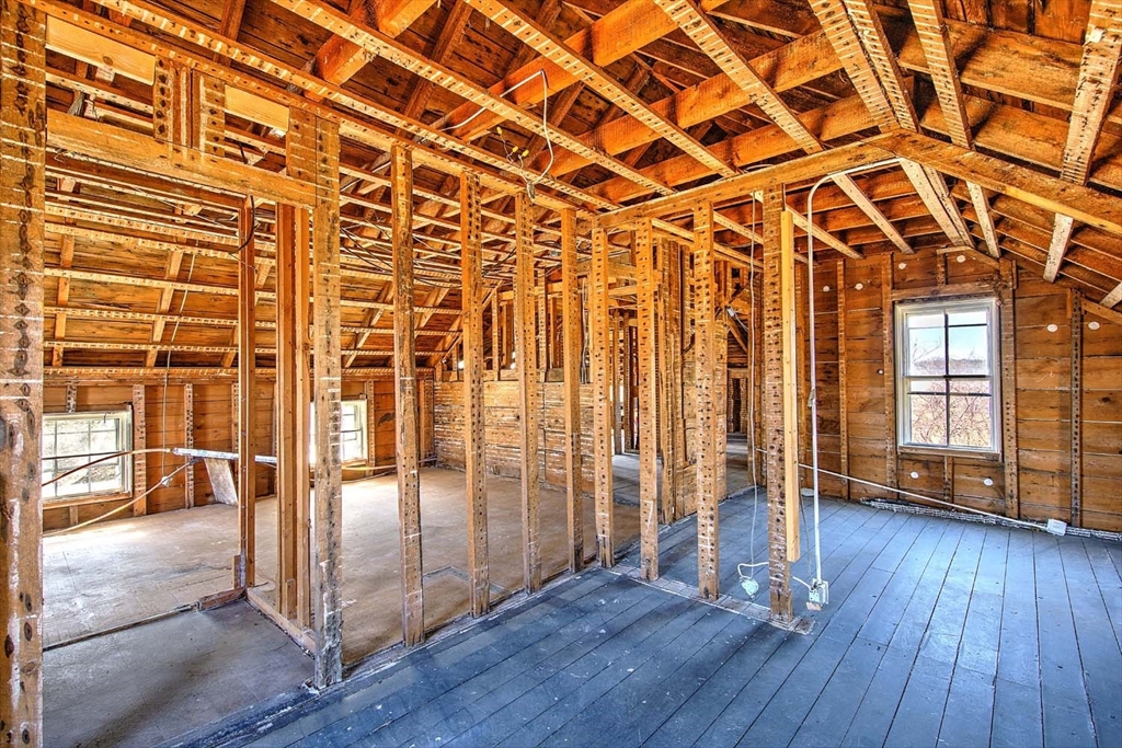 408 Hixbridge Road Westport, MA 02790 - Photo 21 of 35 an empty room with wooden floor and windows