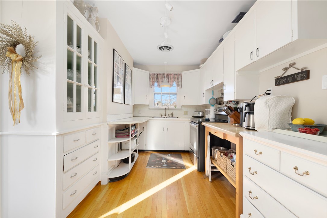 9 White Terrace Middletown, RI 02842 - Photo 25 of 50 Galley kitchen chock full of cooking gadgets.