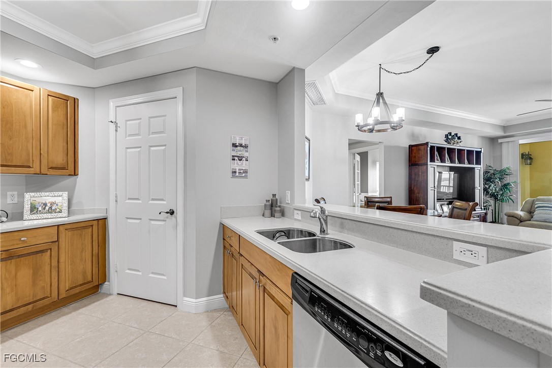 2743 First Street, Unit 1502 Fort Myers, FL 33916 - Photo 10 of 35 a kitchen with stainless steel appliances granite countertop a sink and cabinets