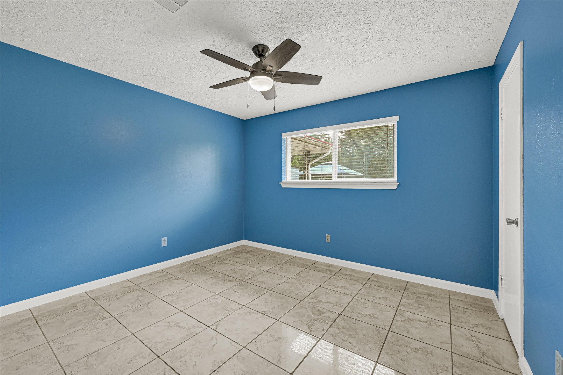 20135 Timber Line Lane New Caney, TX 77357 - Photo 16 of 30 a view of an empty room with a window