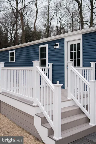 a view of house with a deck