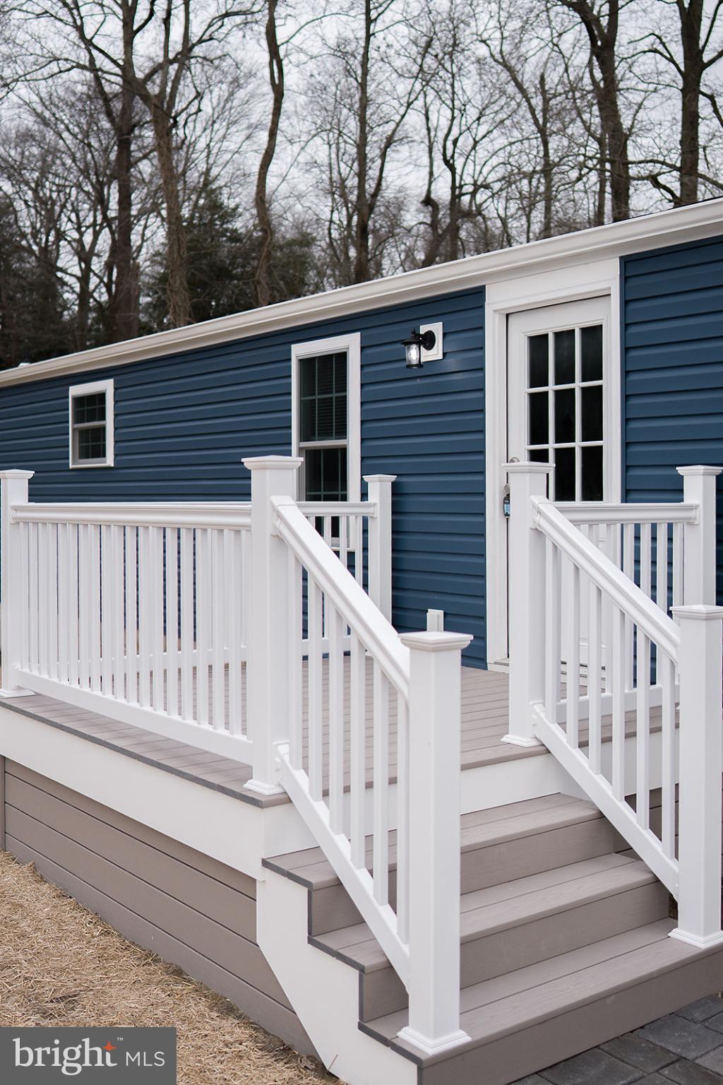 a view of house with a deck