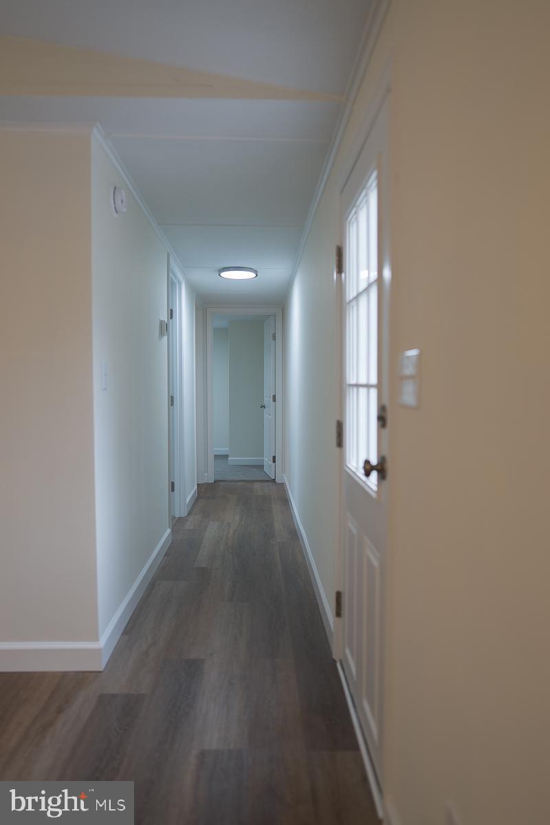 16449 Polk Road Bridgeville, DE 19933 - Photo 13 of 22 a view of a hallway with a white walls