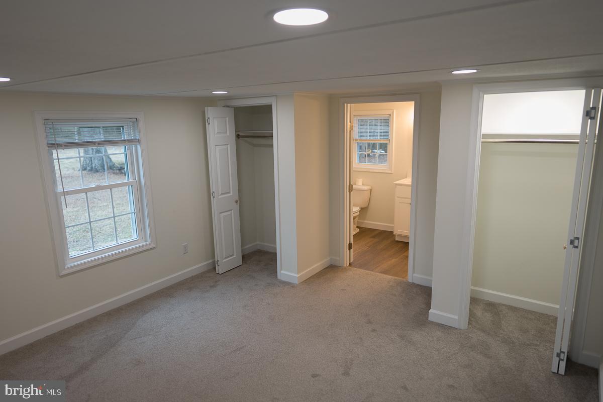 16449 Polk Road Bridgeville, DE 19933 - Photo 15 of 22 an empty room with windows and closet