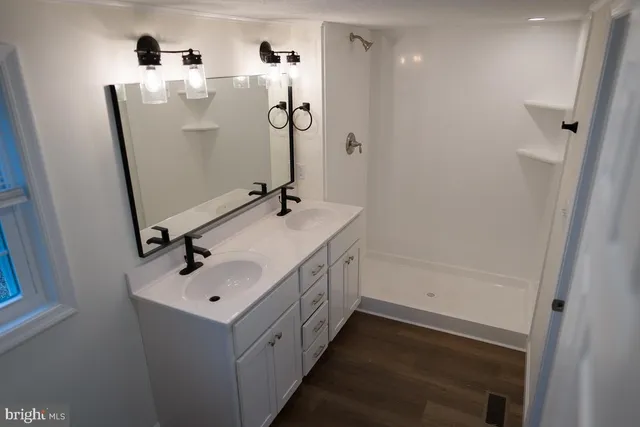 a bathroom with a sink and mirror