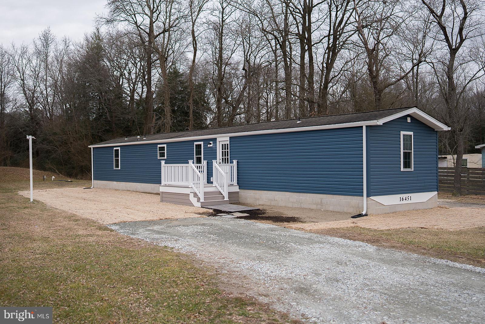16449 Polk Road Bridgeville, DE 19933 - Photo 21 of 22 a house with trees in the background